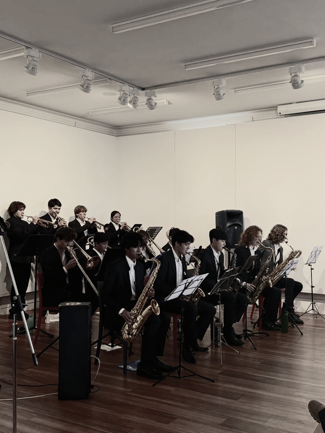 The Mike Sung Big Band performing live — horn sections in full flight